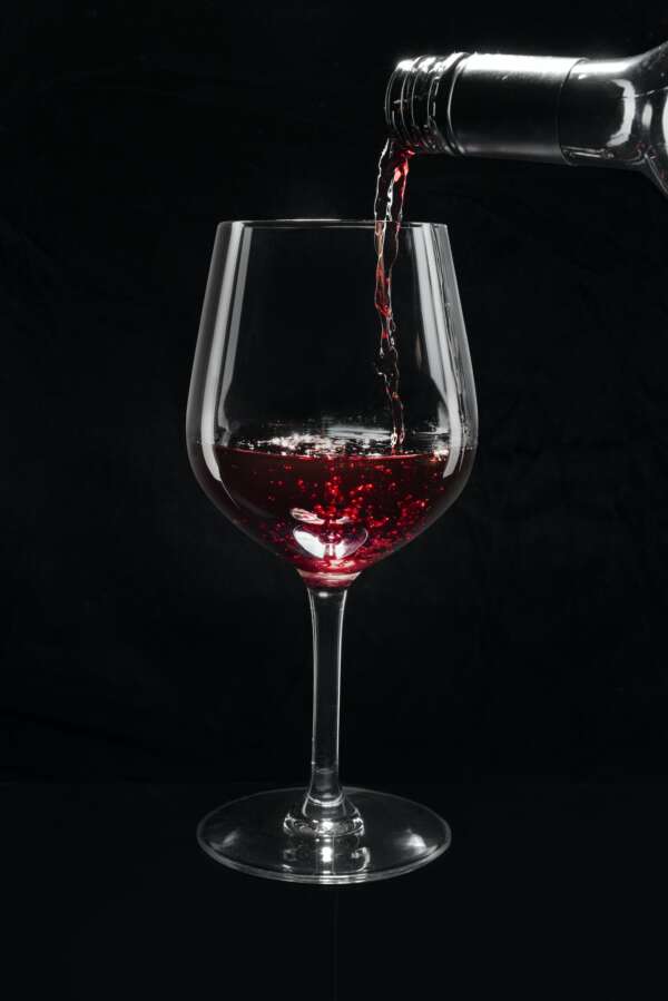 Red wine pouring into a wine glass